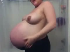 My ally's perverted brunette wife flaunted her enormous, bloated belly.